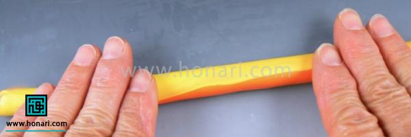 آموزش ساخت گل آفتابگردان با خمیر فیمو-مرحله 14 حالا کارو کمی باریک تر کنید.