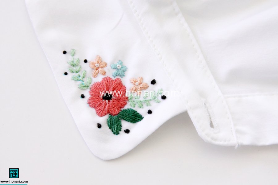 گلدوزی با دست روی لباس