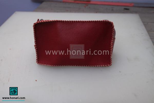 اموزش ساخت کیف لوازم آرایش چرم دوزی-مرحله 14 محل سمبه زده را با استفاده از دوخت کج چرم دوزی بزنید.