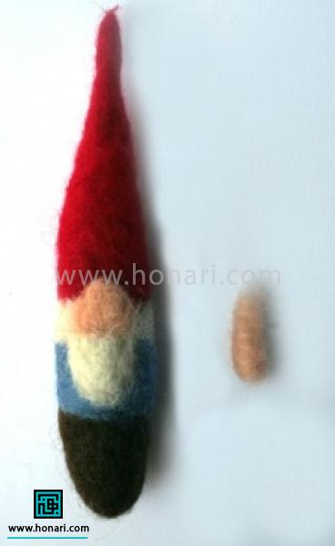 مقداری از الیاف رنگ بدن را برای قسمت بینی برداشته ، رول کرده تا شکل بگیرد و محکم شود 