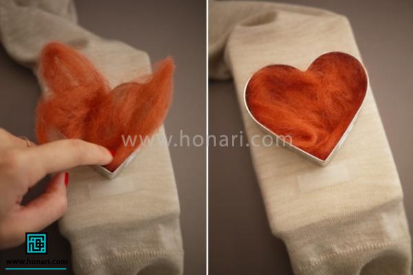 کمی الیاف برداشته و داخل قلب را با الیاف پر کنید.